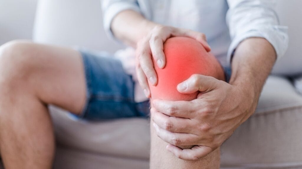 man suffering from pain in the knee